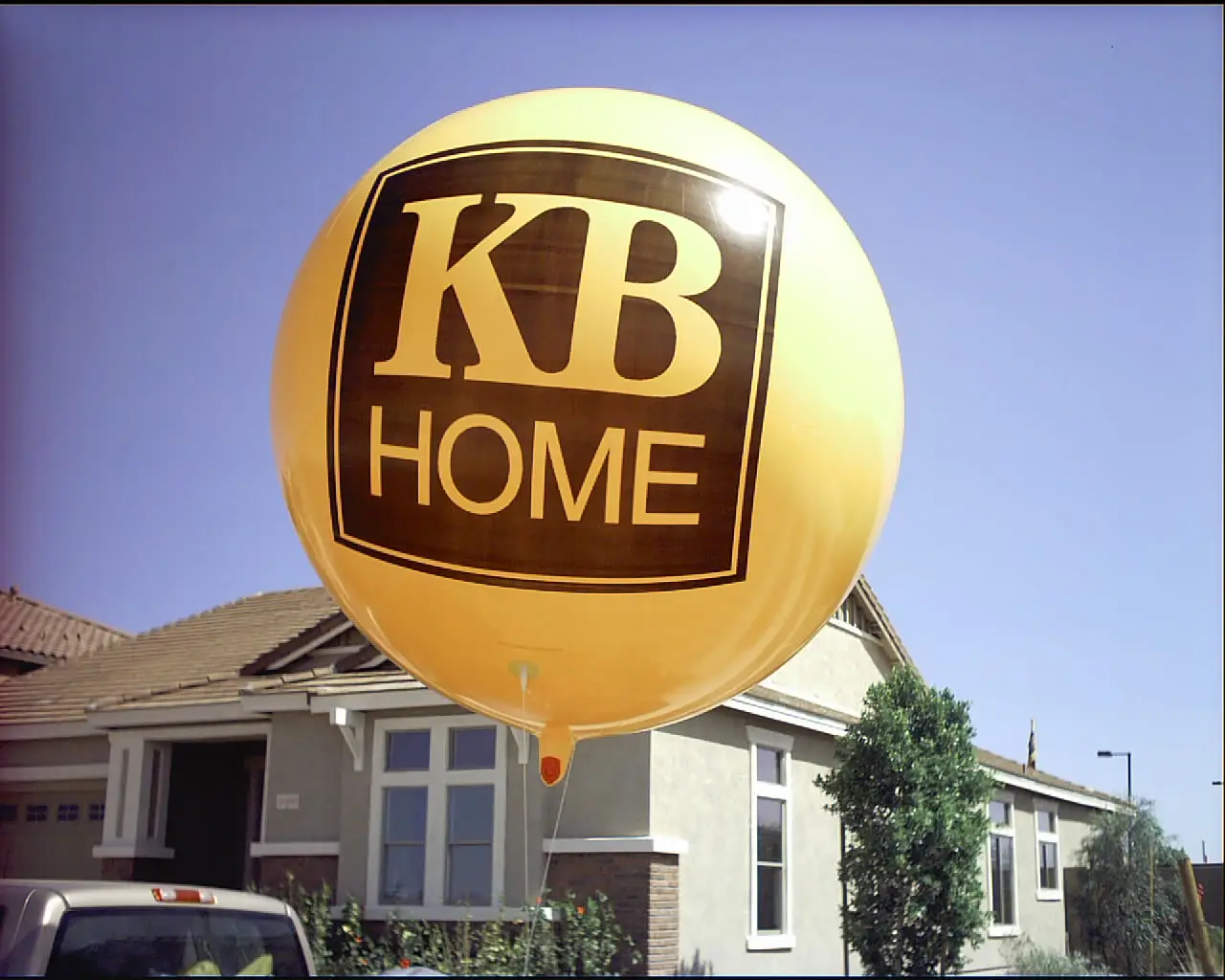 KB Home helium sphere balloon over a model home